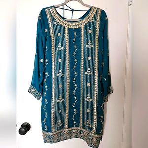 Indian traditional lehnga with long sleeves top with dupatta.